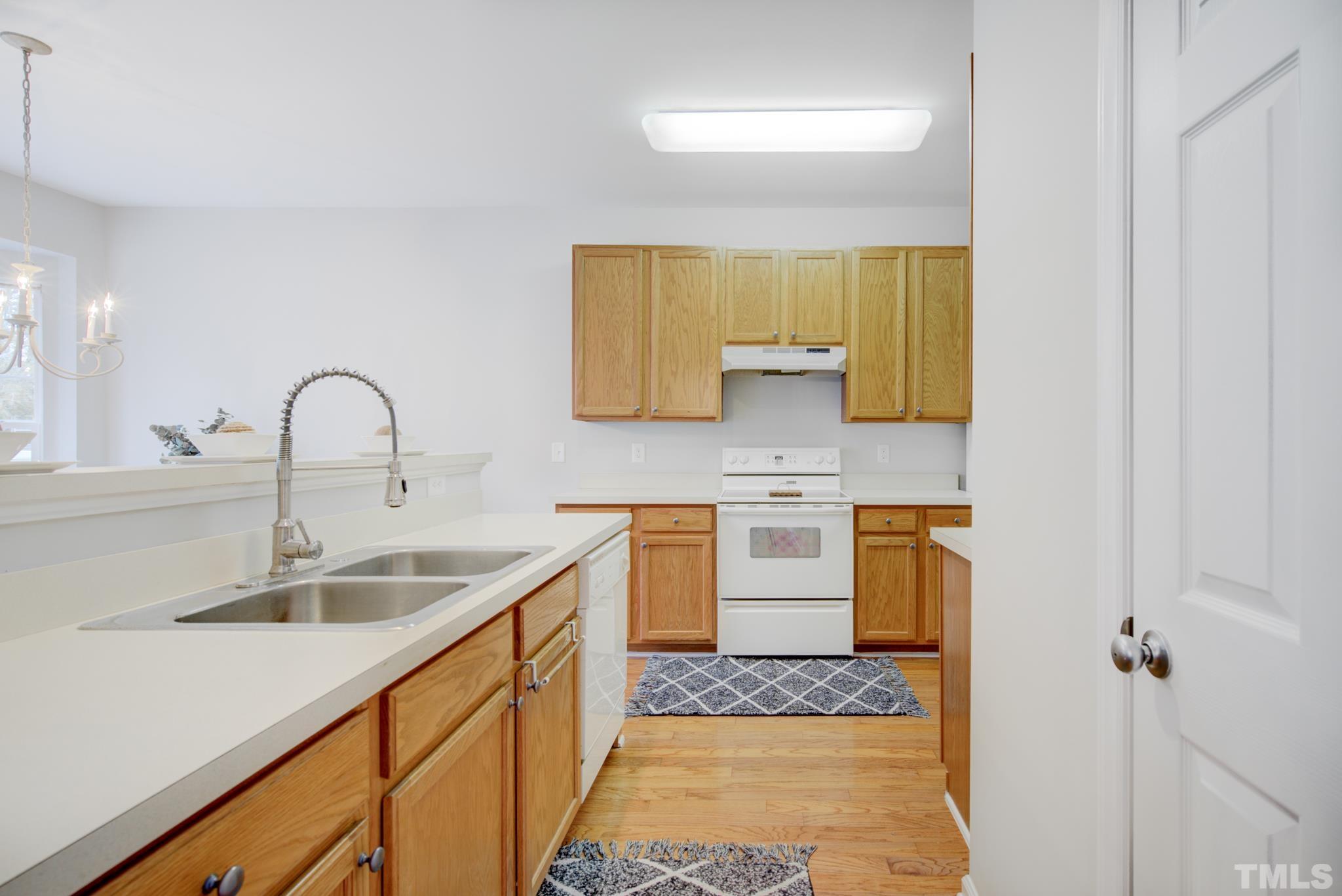 8206 Shadow Stone Court Raleigh, NC 27613 - Photo 21 of 52 a kitchen with a sink and a window