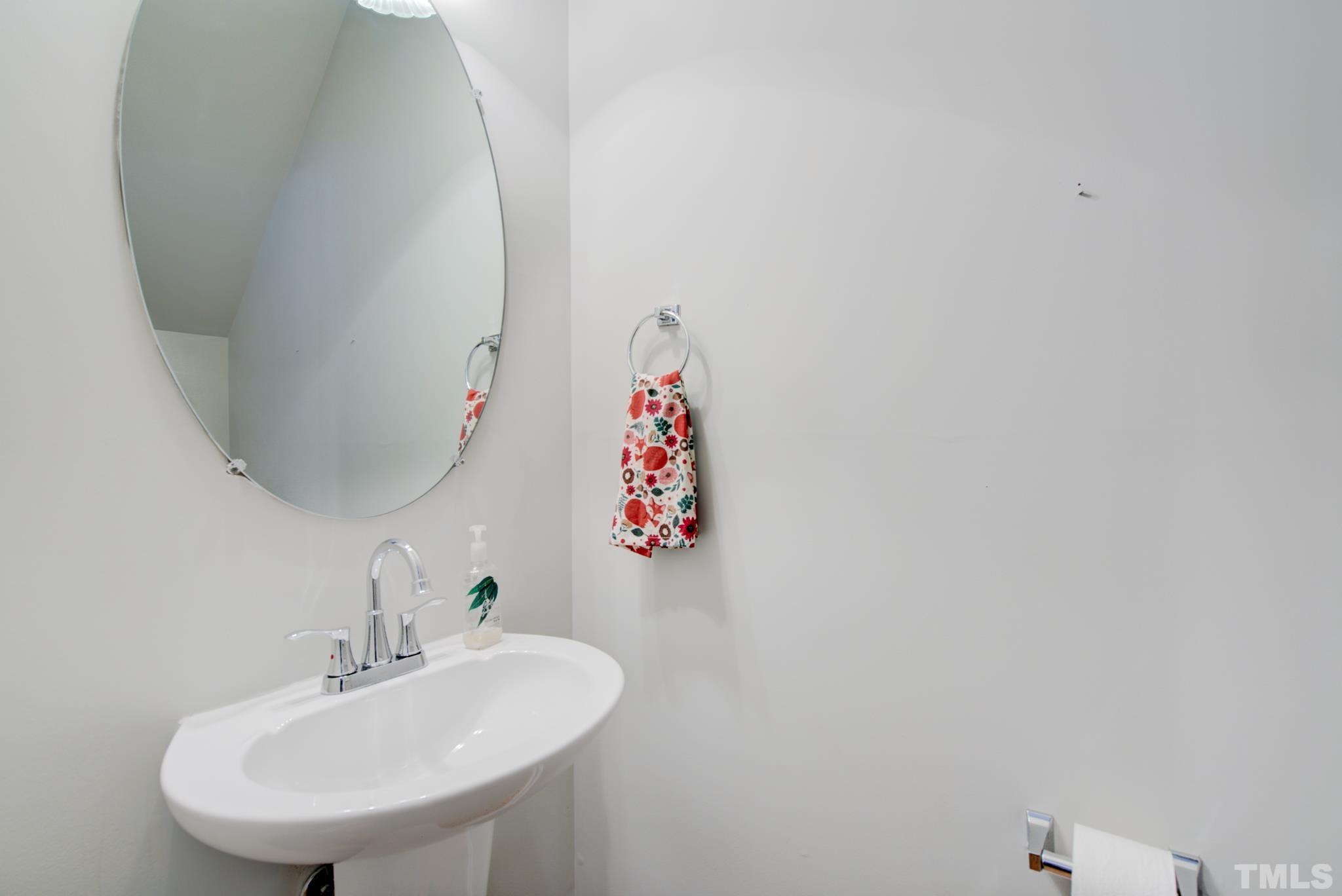 8206 Shadow Stone Court Raleigh, NC 27613 - Photo 26 of 52 a bathroom with a sink and a mirror