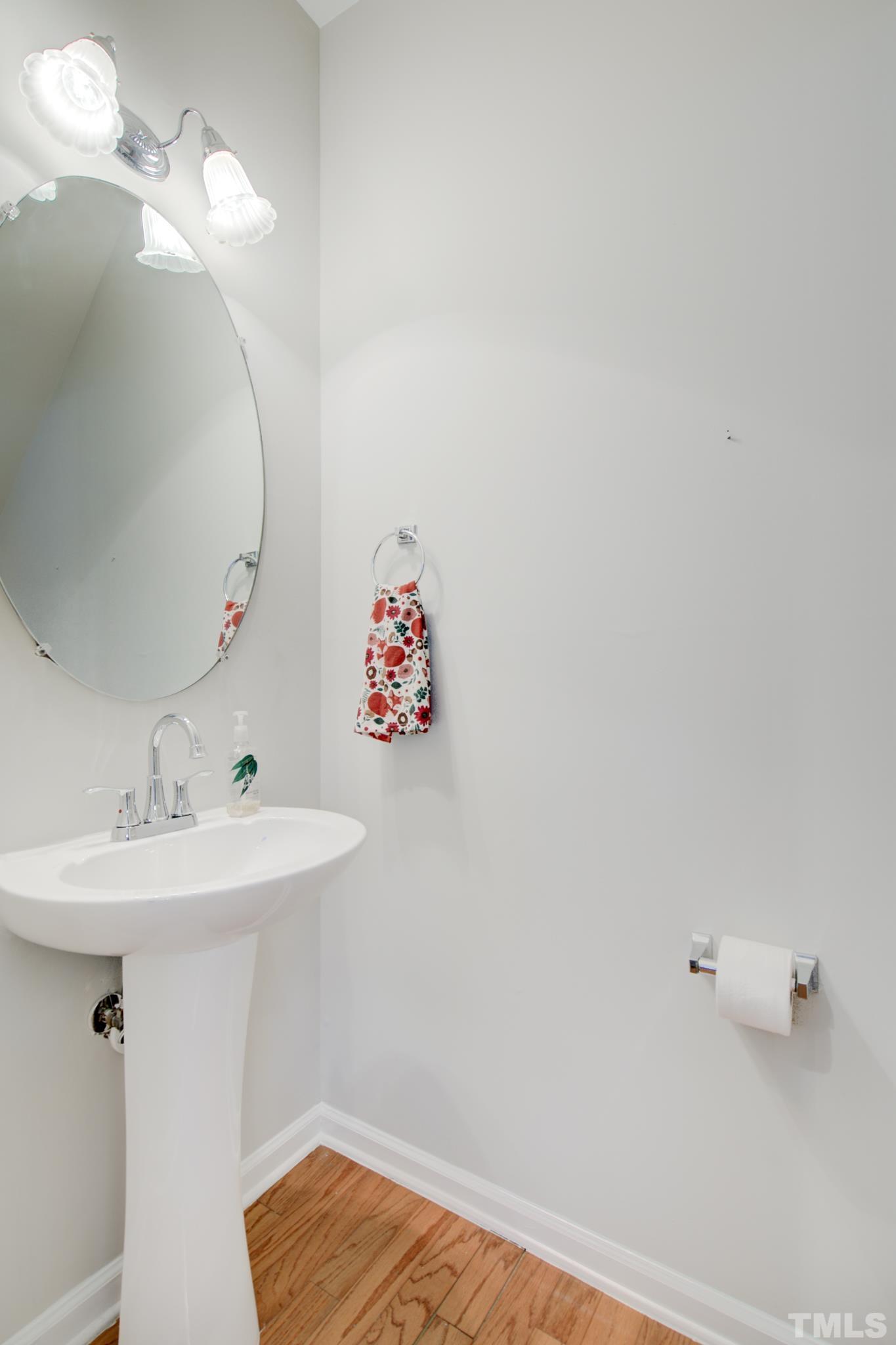 8206 Shadow Stone Court Raleigh, NC 27613 - Photo 27 of 52 a bathroom with a sink and a mirror