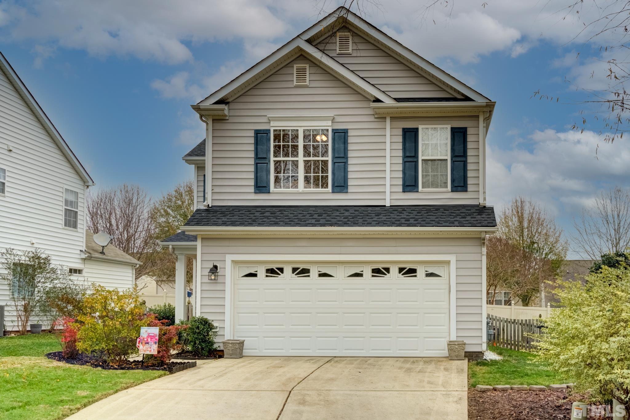 8206 Shadow Stone Court Raleigh, NC 27613 - Photo 5 of 52 a front view of a house with garage