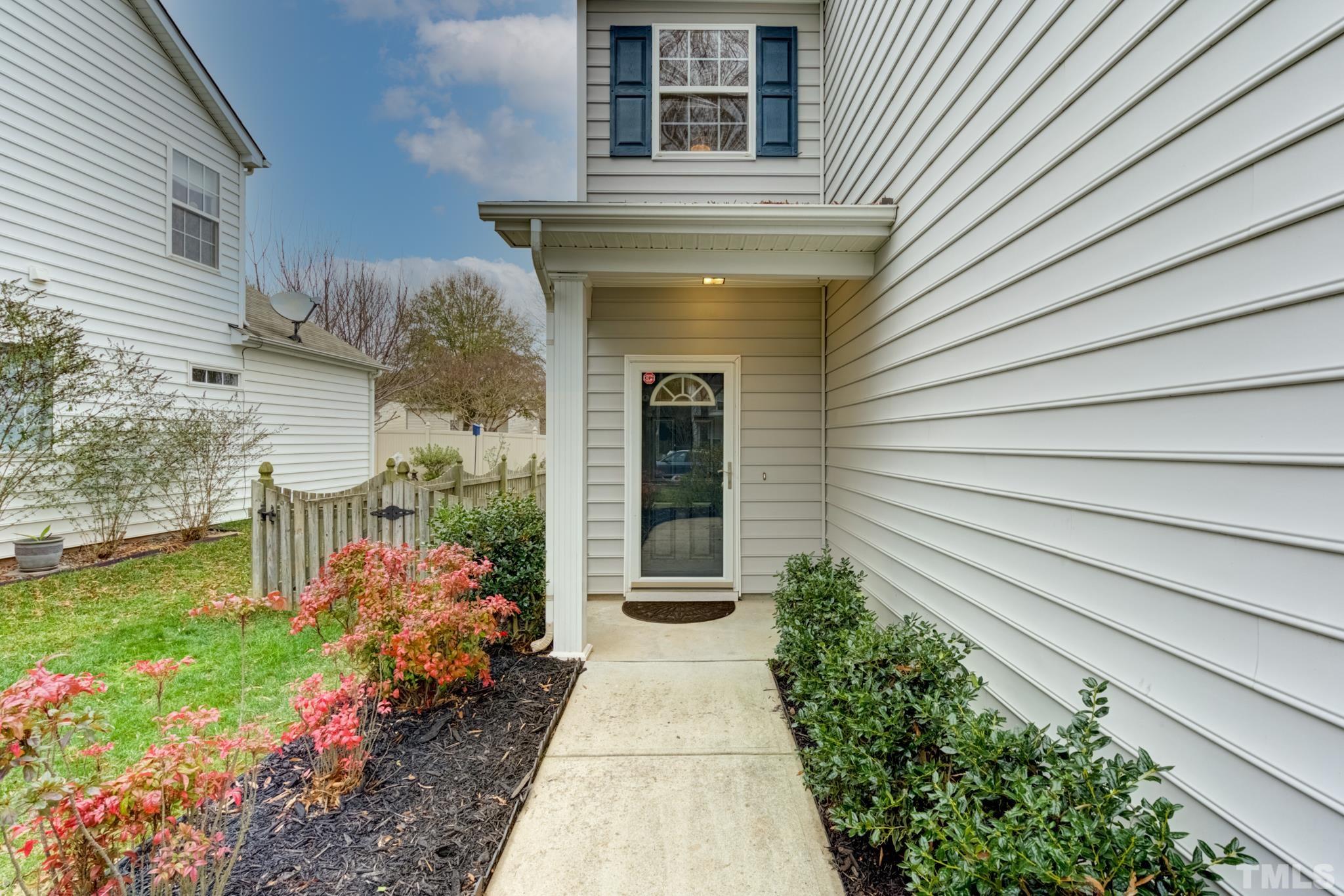 8206 Shadow Stone Court Raleigh, NC 27613 - Photo 6 of 52 a front view of a house with a garden