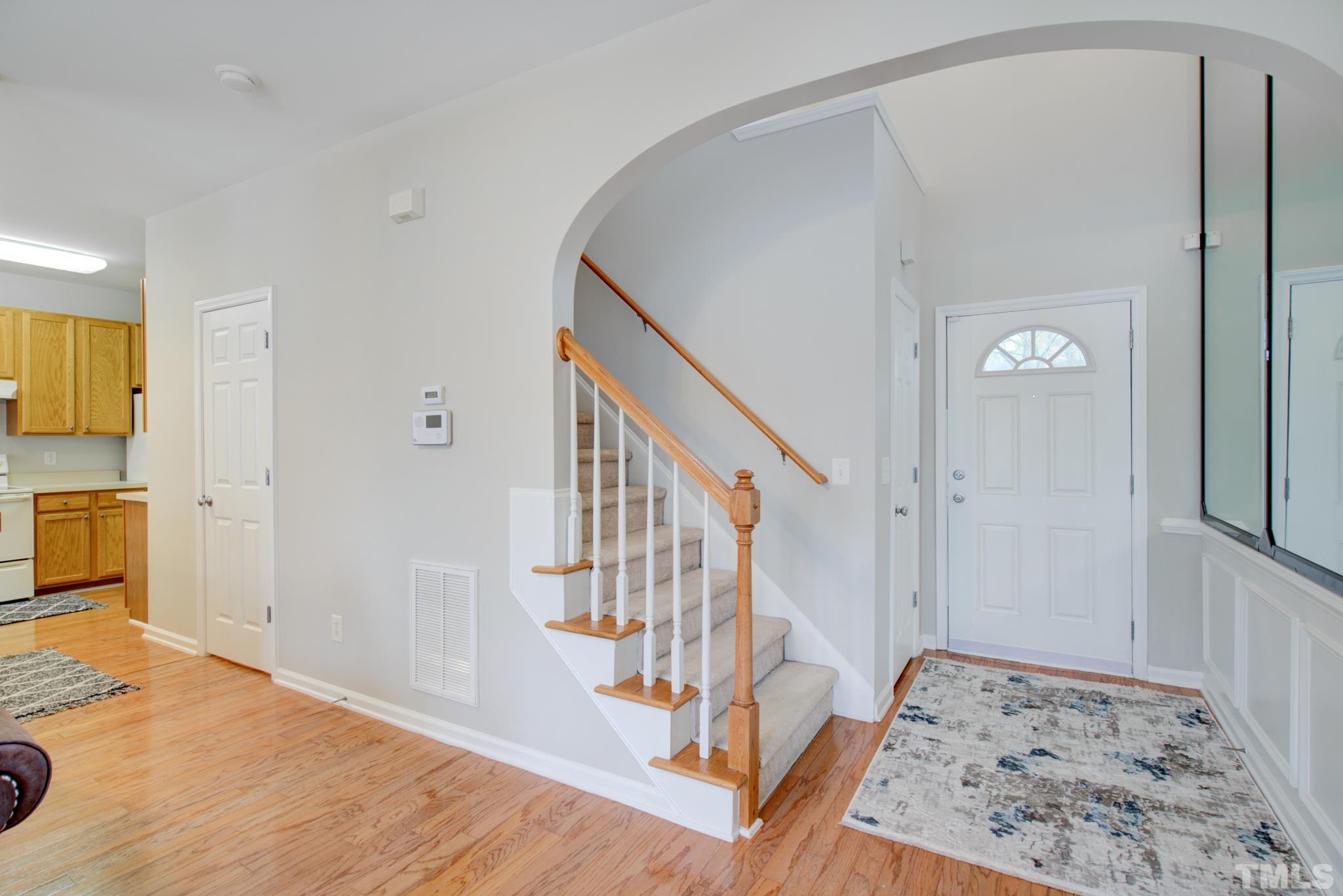 8206 Shadow Stone Court Raleigh, NC 27613 - Photo 8 of 52 a view of an entryway with wooden floor