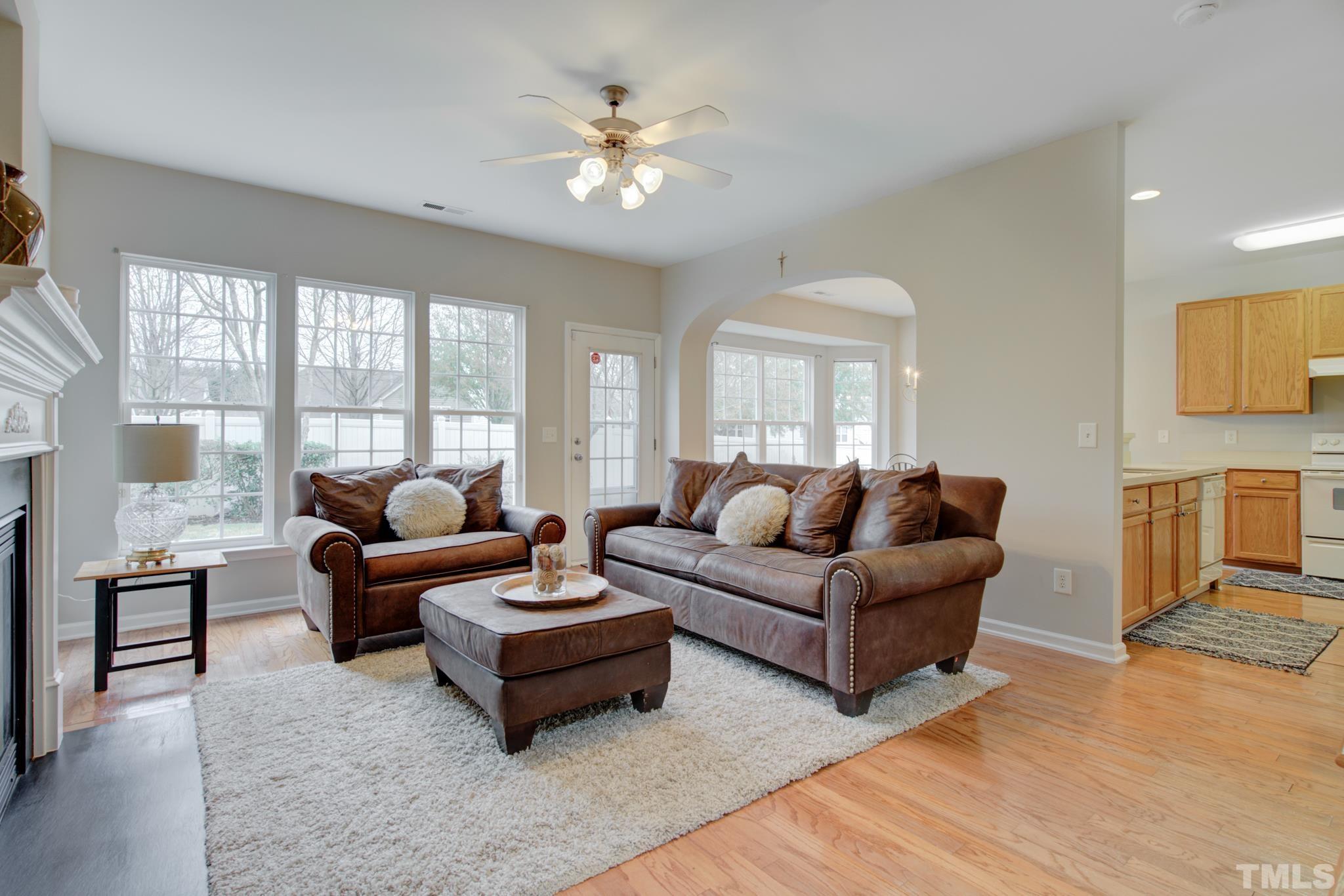 8206 Shadow Stone Court Raleigh, NC 27613 - Photo 9 of 52 a living room with furniture and a chandelier