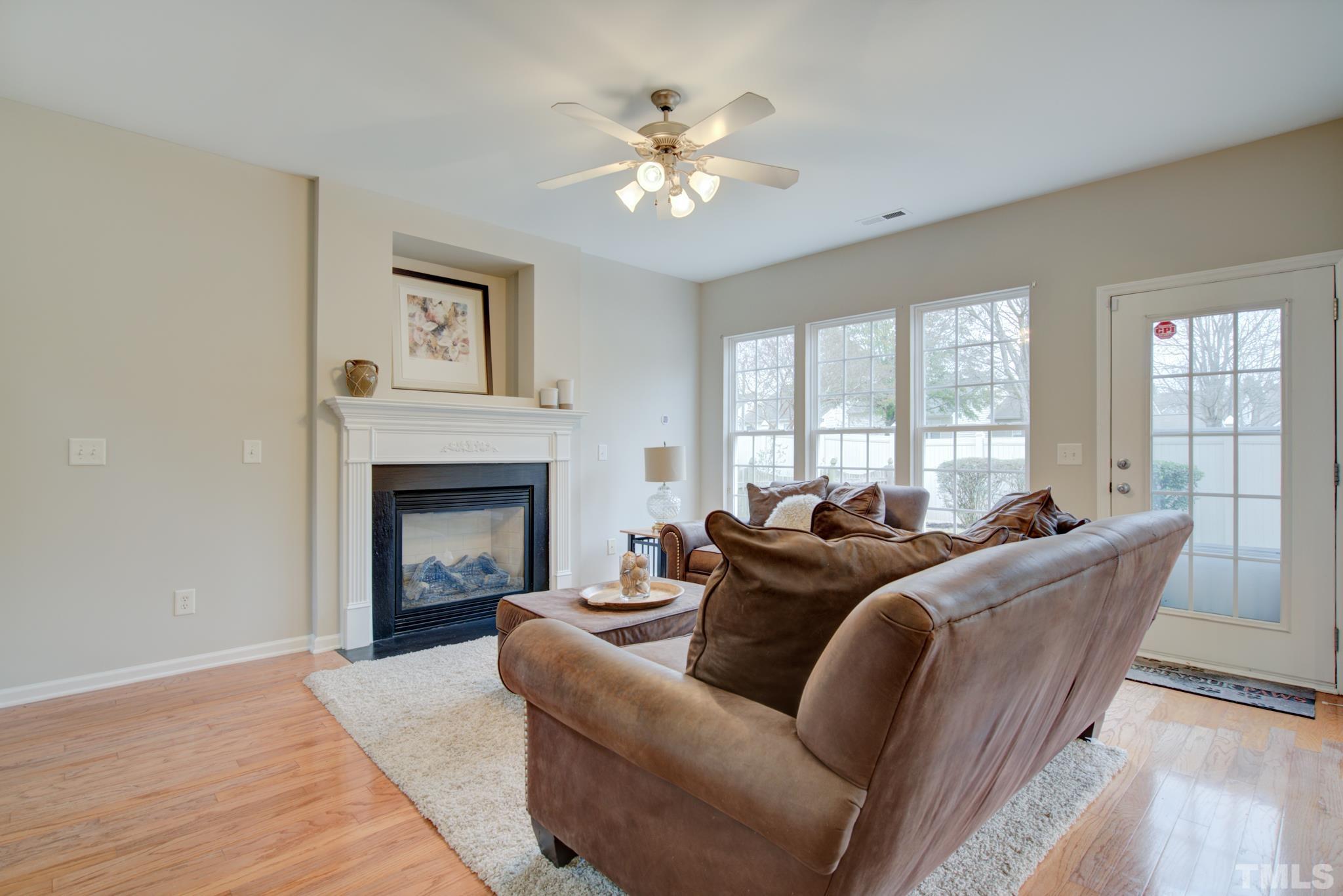 8206 Shadow Stone Court Raleigh, NC 27613 - Photo 10 of 52 a living room with furniture and a fireplace