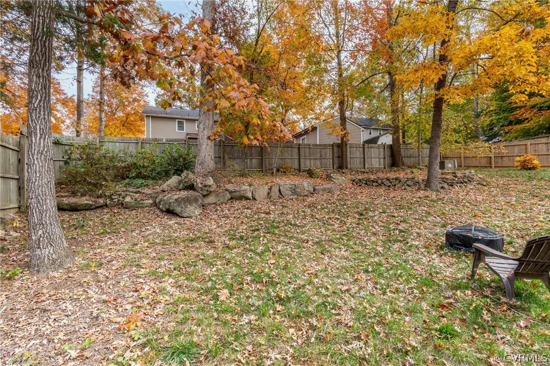 2631 Colgrave Road Midlothian, VA 23112 - Photo 23 of 23 a backyard of a house with table and chairs