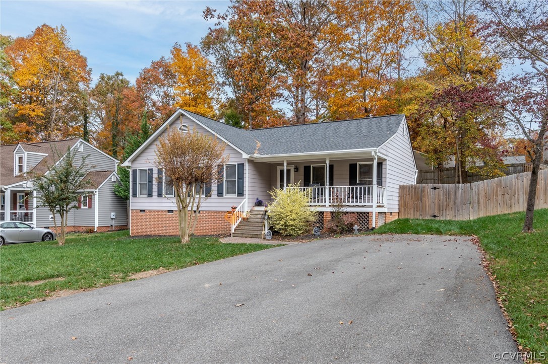 2631 Colgrave Road Midlothian, VA 23112 - Photo 3 of 23 a front view of a house with a garden and porch