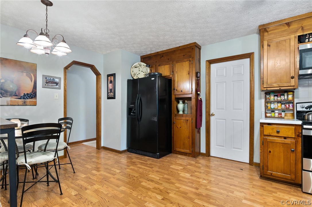 2631 Colgrave Road Midlothian, VA 23112 - Photo 9 of 23 a view of a kitchen with refrigerator and cabinets