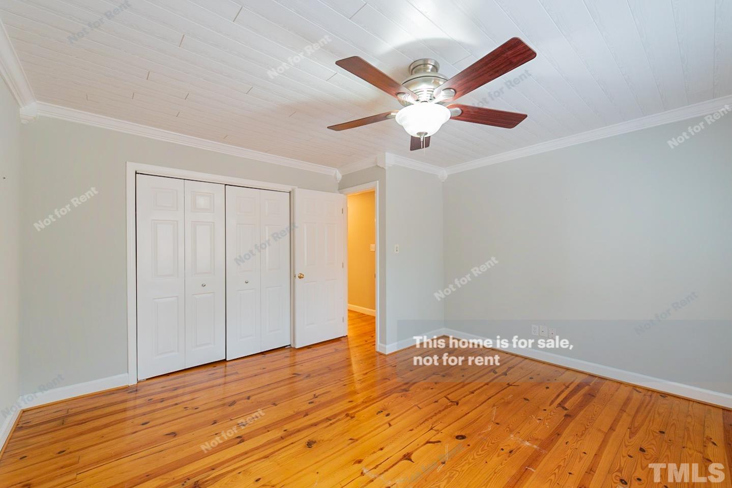 12008 Shooting Club Road Raleigh, NC 27613 - Photo 14 of 23 a view of empty room with wooden floor