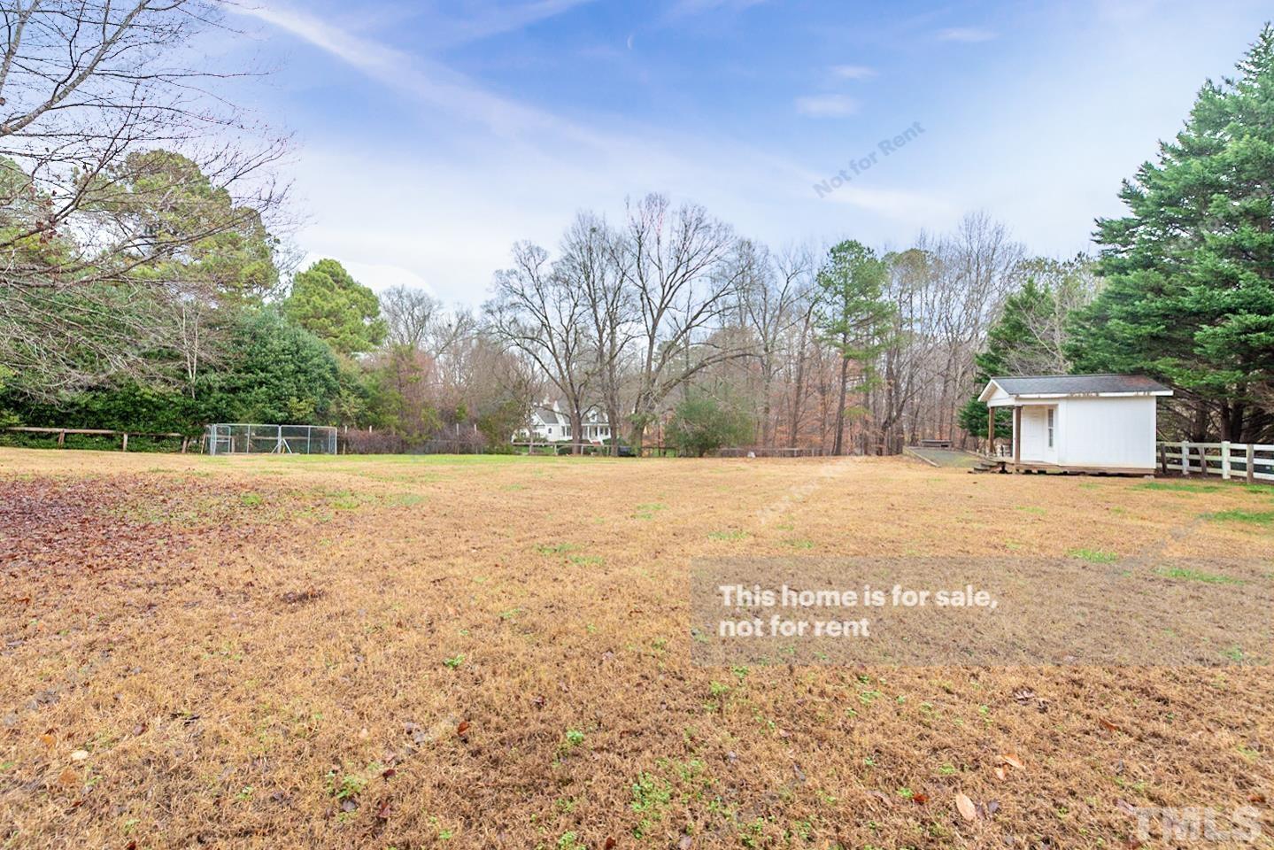 12008 Shooting Club Road Raleigh, NC 27613 - Photo 20 of 23 a view of a yard with a house