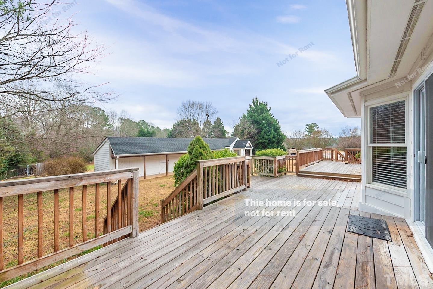 12008 Shooting Club Road Raleigh, NC 27613 - Photo 23 of 23 a view of balcony with wooden floor and fence