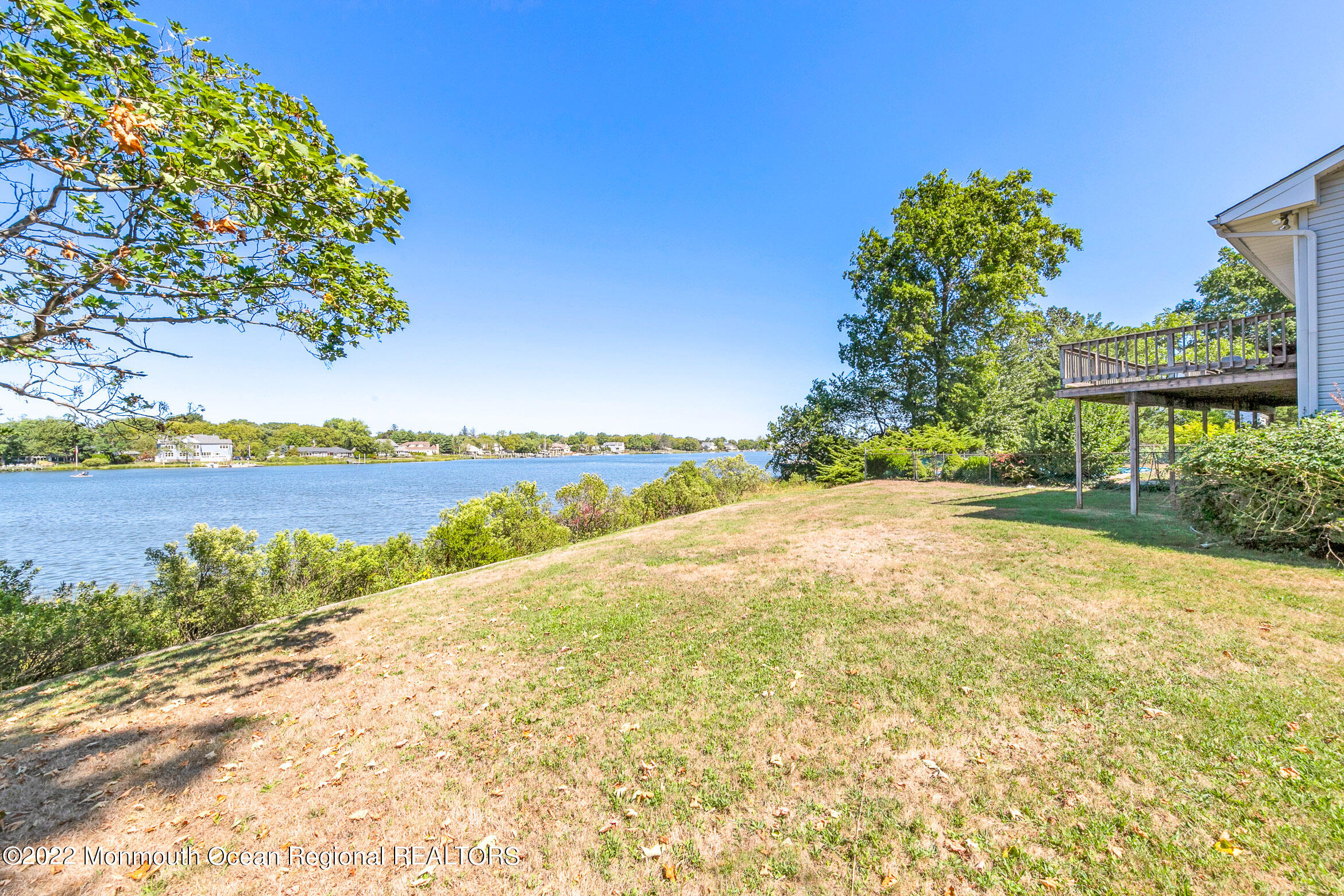 69 Horseneck Point Road Oceanport, NJ 07757 - Photo 16 of 22 a view of a lake with a beach