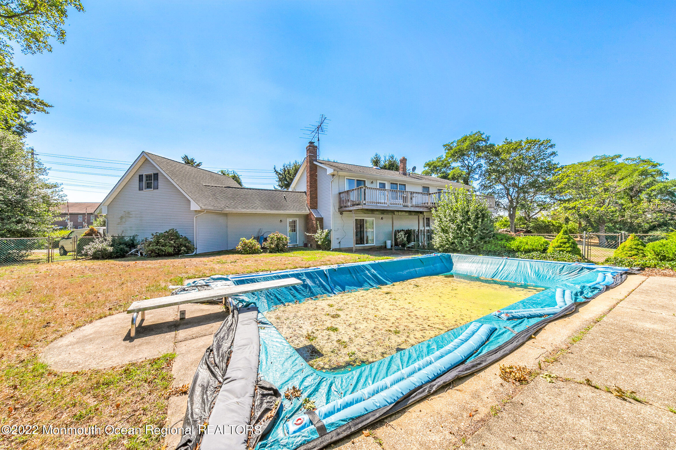 69 Horseneck Point Road Oceanport, NJ 07757 - Photo 19 of 22 a view of a swimming pool with a lounge chairs