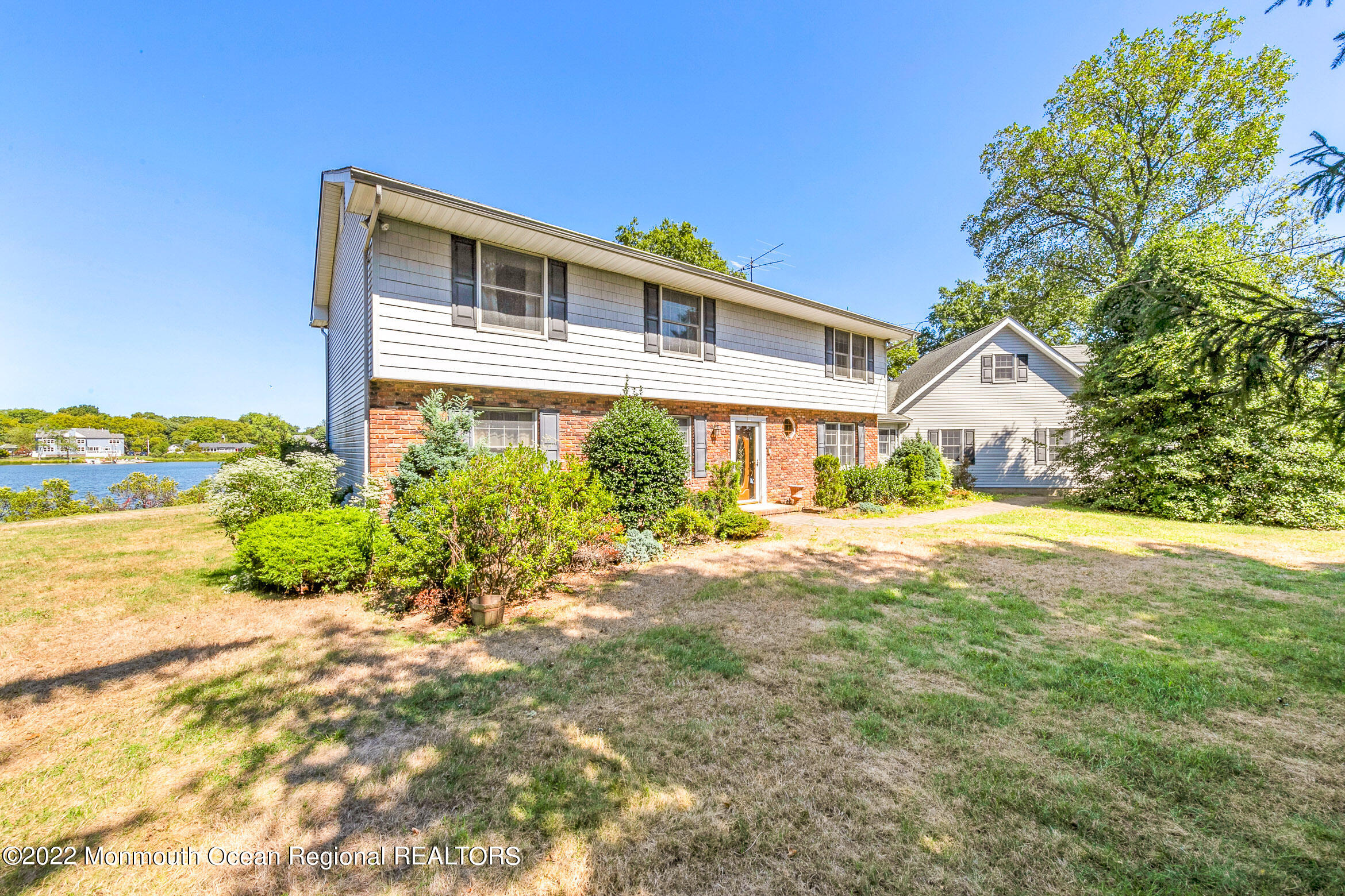 69 Horseneck Point Road Oceanport, NJ 07757 - Photo 2 of 22 a house view with a garden space