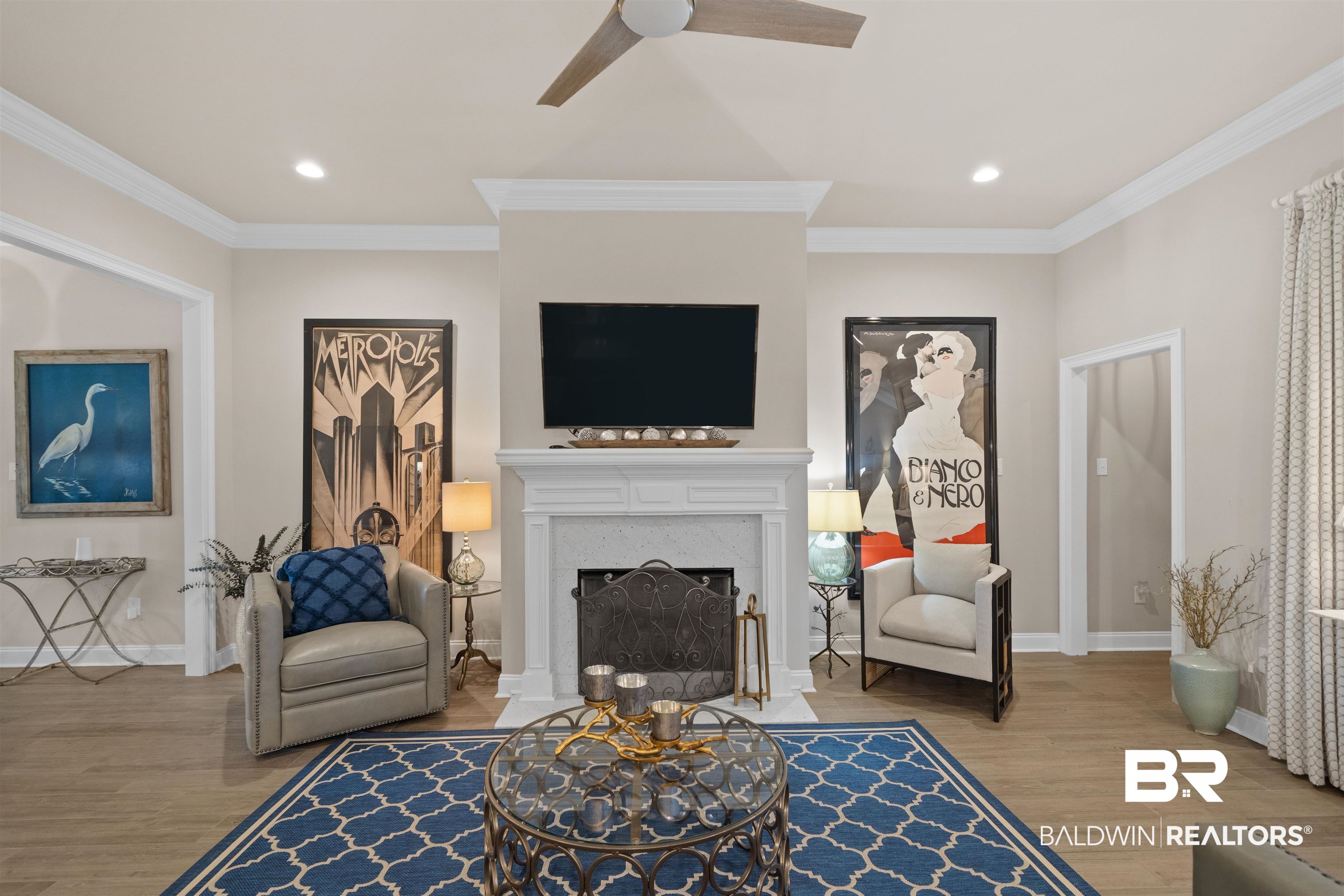 1509 Fenton Circle Foley, AL 36535 - Photo 11 of 34 Living room featuring baseboards, ceiling fan, wood finished floors, and crown molding