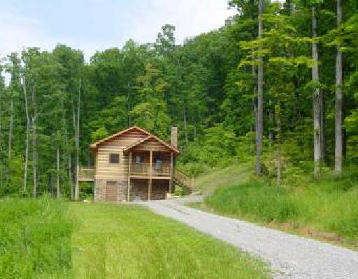 1266 Buck Mountain Road Goodview, VA 24095 - Photo 1 of 1 a front view of a house with a yard