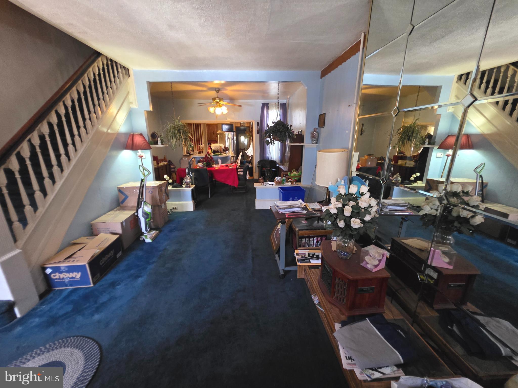 1317 East Rittenhouse Street Philadelphia, PA 19138 - Photo 2 of 16 a living room with lots of furniture and a chandelier