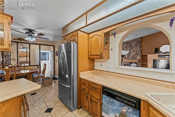 a kitchen with a refrigerator and countertop