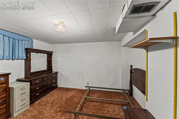 a view of a livingroom with furniture and a fireplace