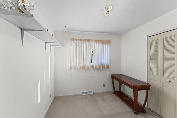 a view of a hallway with closet