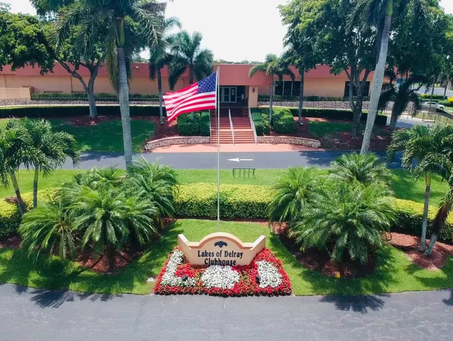 an aerial view of a house with a garden and swimming pool