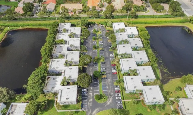 a view of a lake with a house in the background