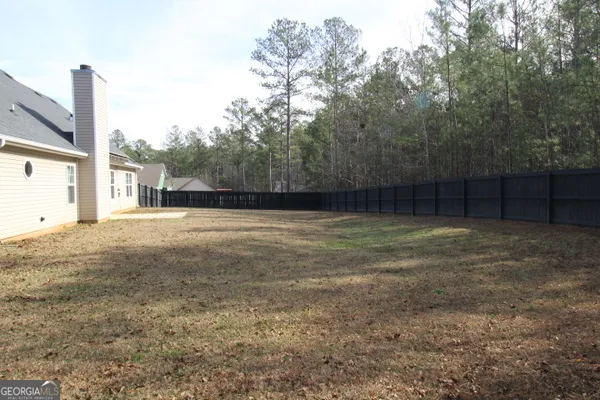 a view of a yard with a tree