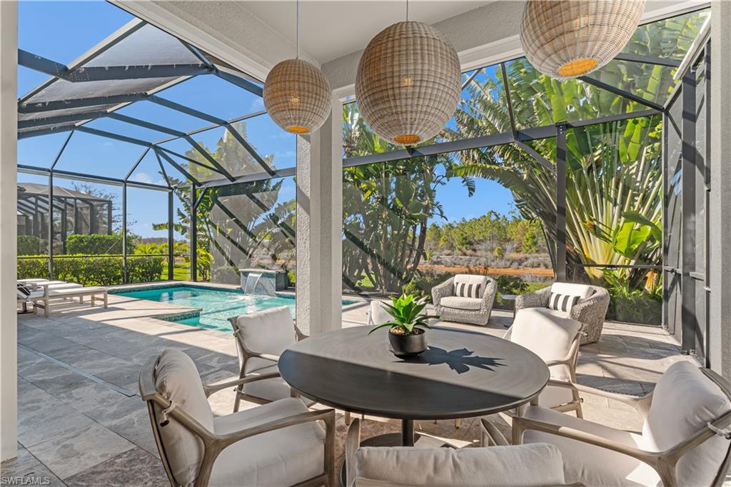 9517 Montelanico Loop Naples, FL 34119 - Photo 27 of 50 a view of yard with patio