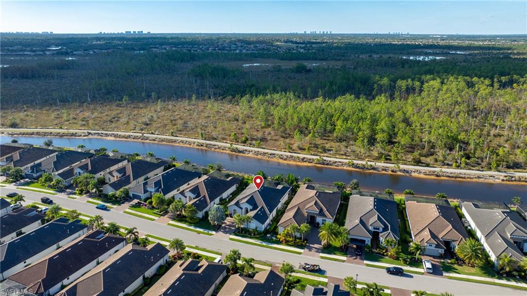 9517 Montelanico Loop Naples, FL 34119 - Photo 34 of 50 a view of a street with an outdoor space