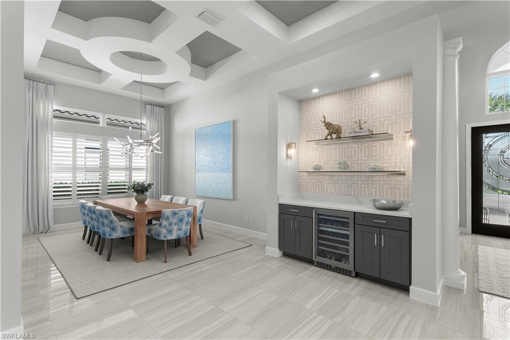 9517 Montelanico Loop Naples, FL 34119 - Photo 5 of 50 a view of a dining room with furniture and wooden floor