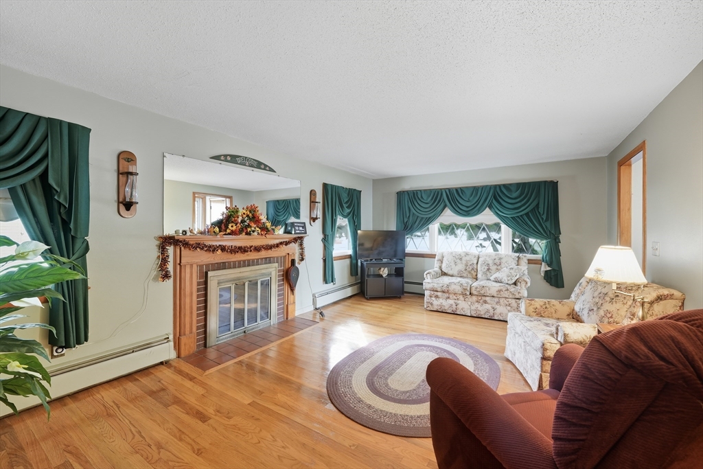 95 Meadowbrook Road Agawam, MA 01001 - Photo 15 of 39 a living room with furniture and a fireplace