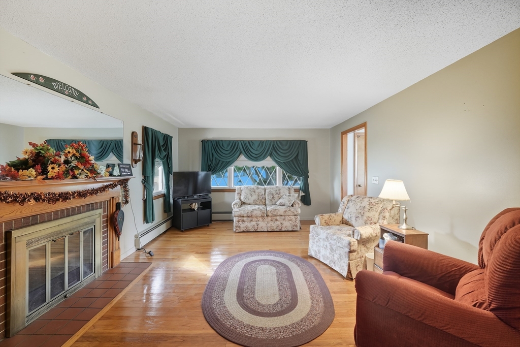 95 Meadowbrook Road Agawam, MA 01001 - Photo 16 of 39 a living room with furniture and a fireplace