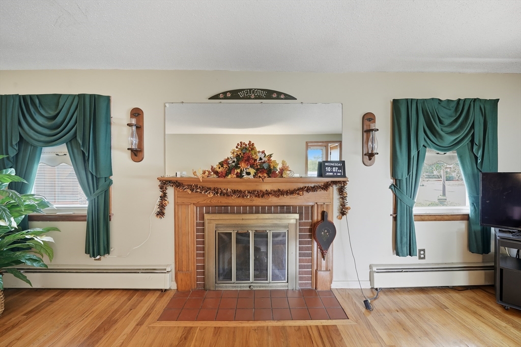 95 Meadowbrook Road Agawam, MA 01001 - Photo 19 of 39 a living room with furniture and a fireplace