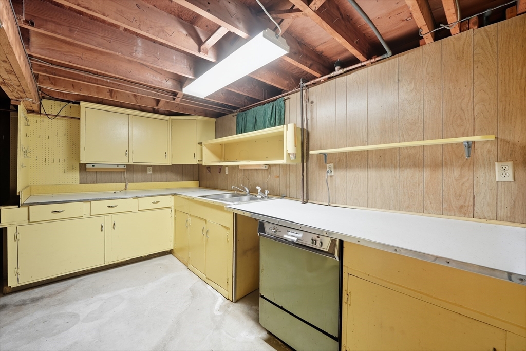 95 Meadowbrook Road Agawam, MA 01001 - Photo 26 of 39 a kitchen with a sink and cabinets