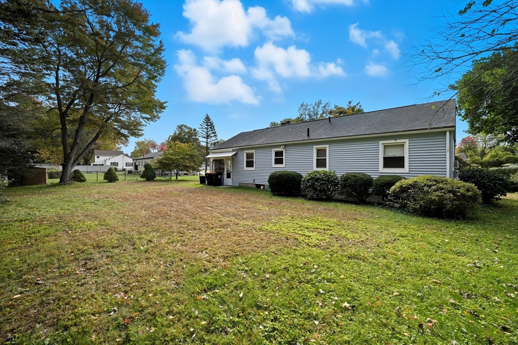 95 Meadowbrook Road Agawam, MA 01001 - Photo 34 of 39 a view of a white house with a big yard and large trees