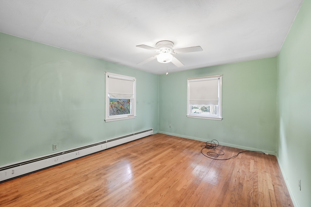 95 Meadowbrook Road Agawam, MA 01001 - Photo 6 of 39 a view of empty room with wooden floor and fan