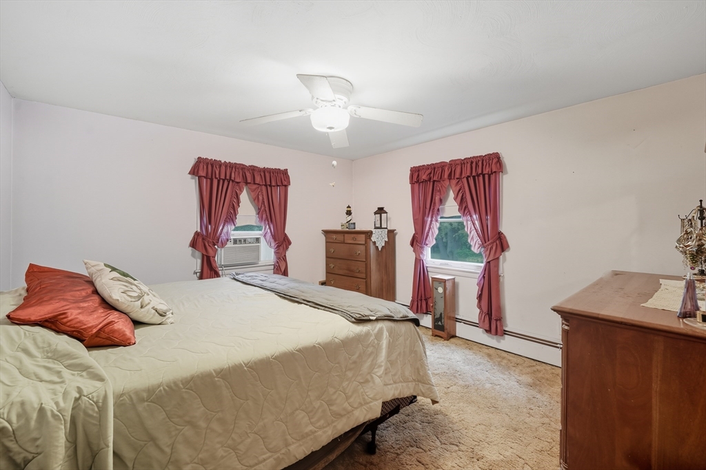 95 Meadowbrook Road Agawam, MA 01001 - Photo 9 of 39 a bedroom with a bed and a dresser