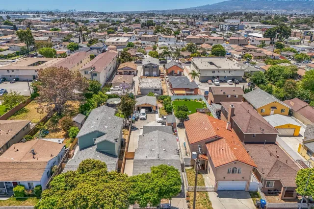 an aerial view of residential houses with outdoor space