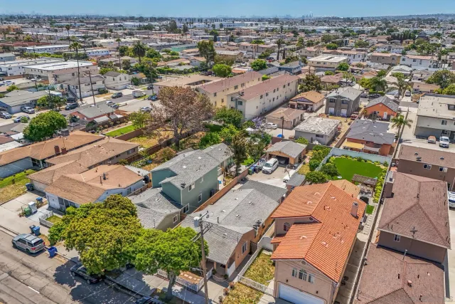 an aerial view of residential houses with outdoor space