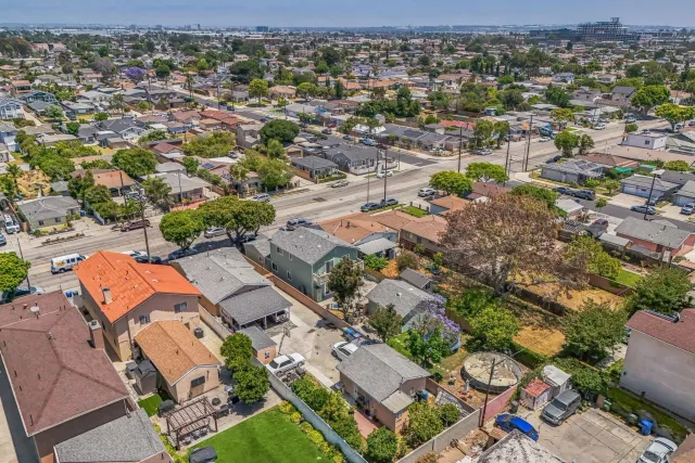 an aerial view of residential houses with outdoor space