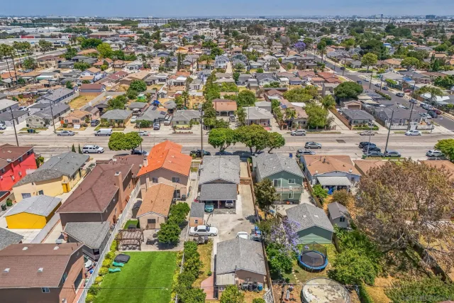 an aerial view of residential houses with outdoor space