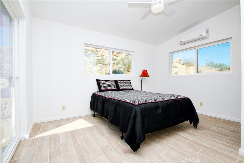 4650 Sizer Canyon Road Johnson Valley, CA 92285 - Photo 15 of 36 a bedroom with a bed and window