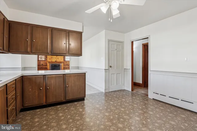 a kitchen with cabinets a sink and appliances