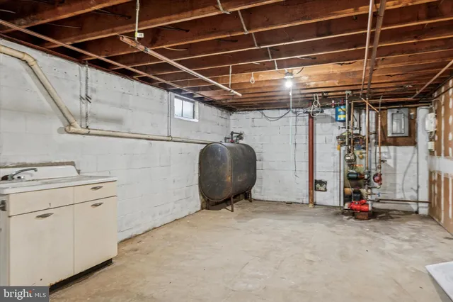 a white house that has tree in front of it