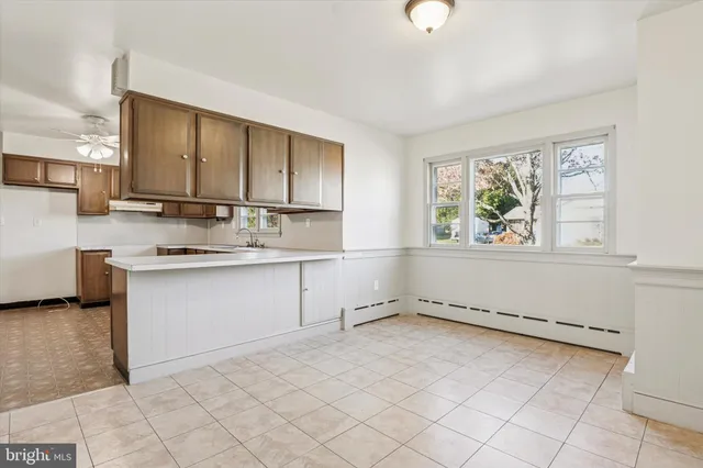 a kitchen with a stove a sink and a refrigerator
