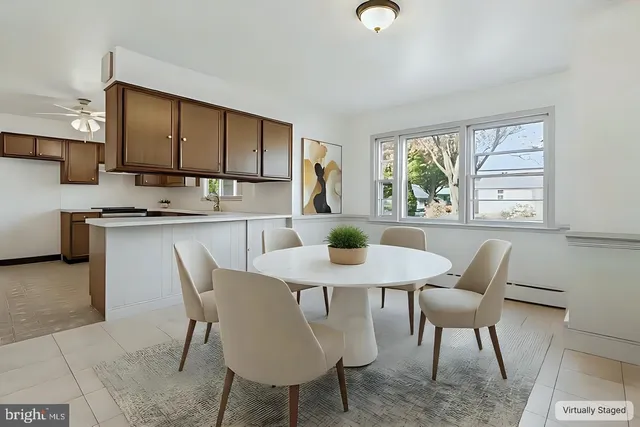 a view of a dining room with furniture window and outside view