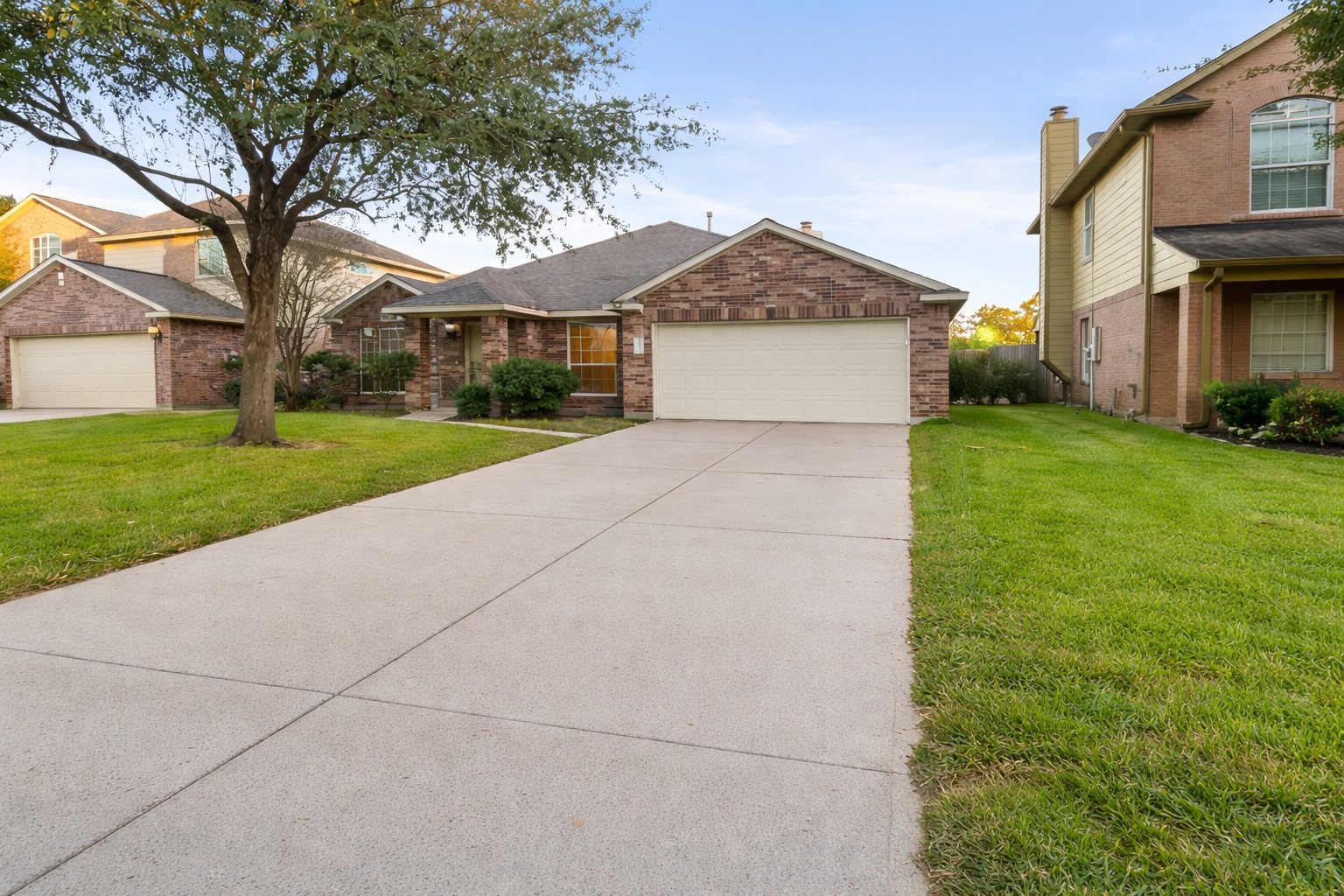 3522 Brackenfern Road Katy, TX 77449 - Photo 2 of 17 a view of a white house next to a yard with big trees