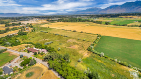 19 East Southfield Road Spanish Fork, UT 84660 - Photo 28 of 74 Aerial view of sparsely populated area featuring a mountainous background
