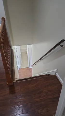 a view of entryway with wooden floor