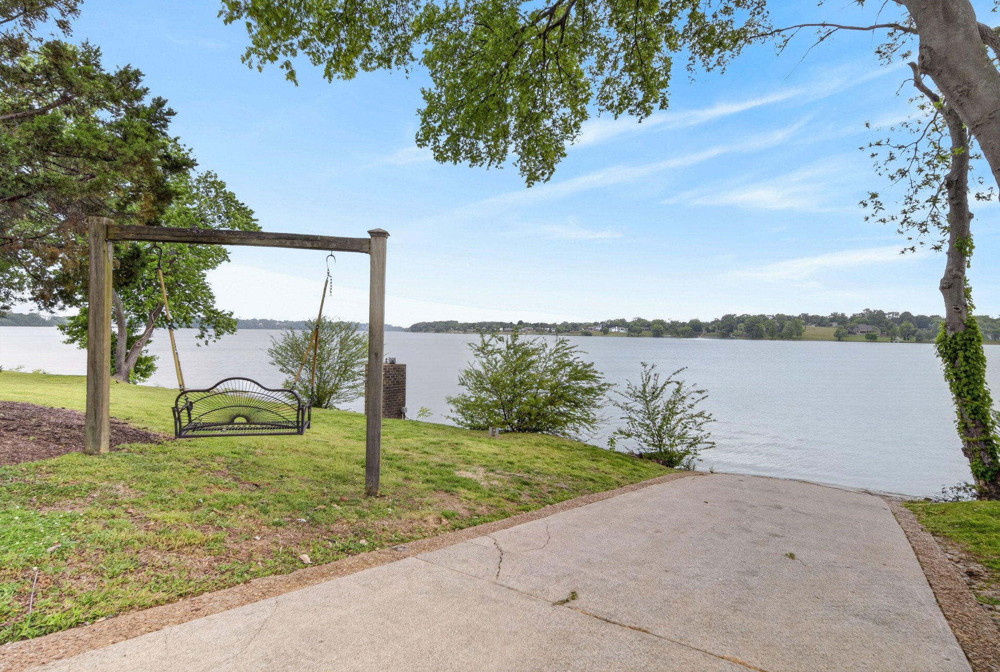 101 Kennett Road Old Hickory, TN 37138 - Photo 18 of 100 a view of a lake with a big yard and large trees