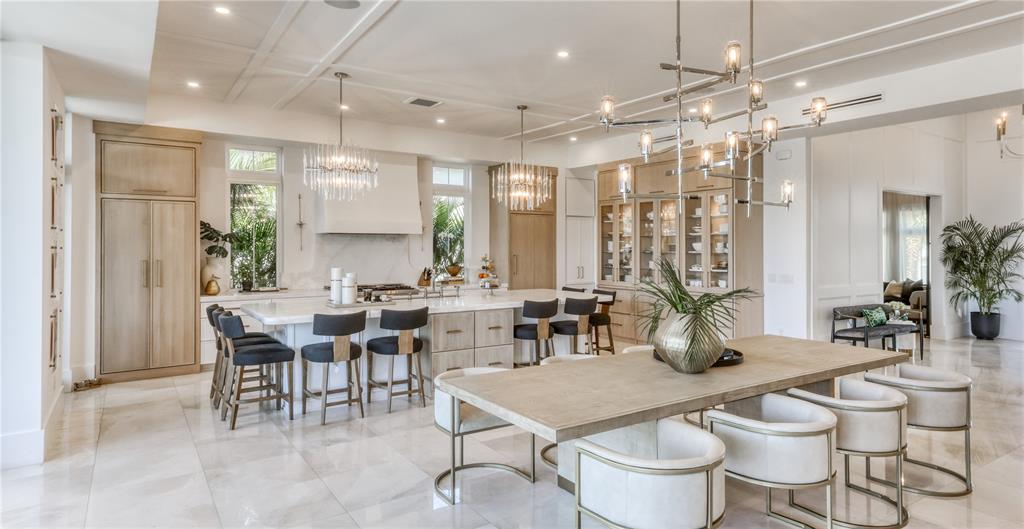 4923 West San Rafael Street Tampa, FL 33629 - Photo 15 of 70 a large dining space with furniture a chandelier and window